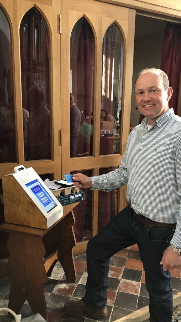 Man paying on a contactless payment device